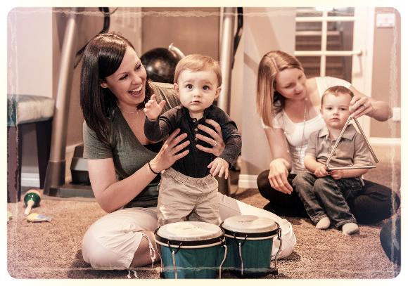 Mothers playing instruments with their children.